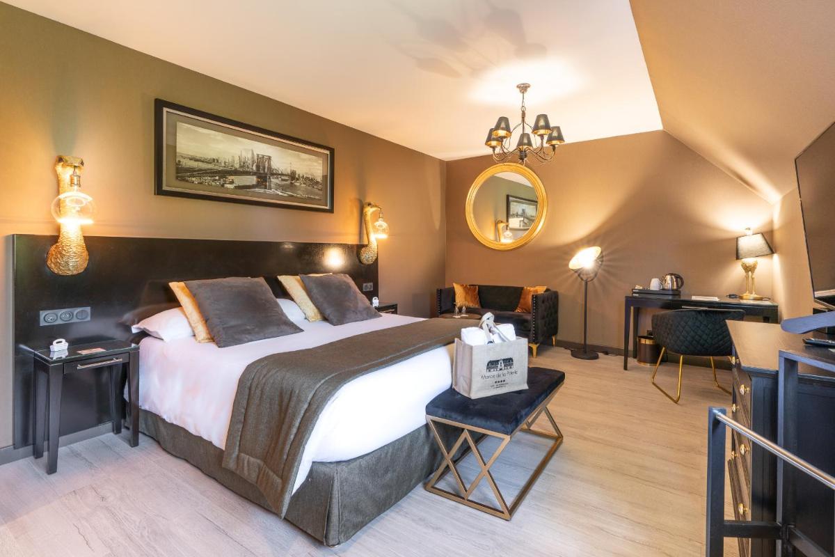 Un ou plusieurs lits dans un hébergement de l'établissement Le Manoir De La Poterie & Spa