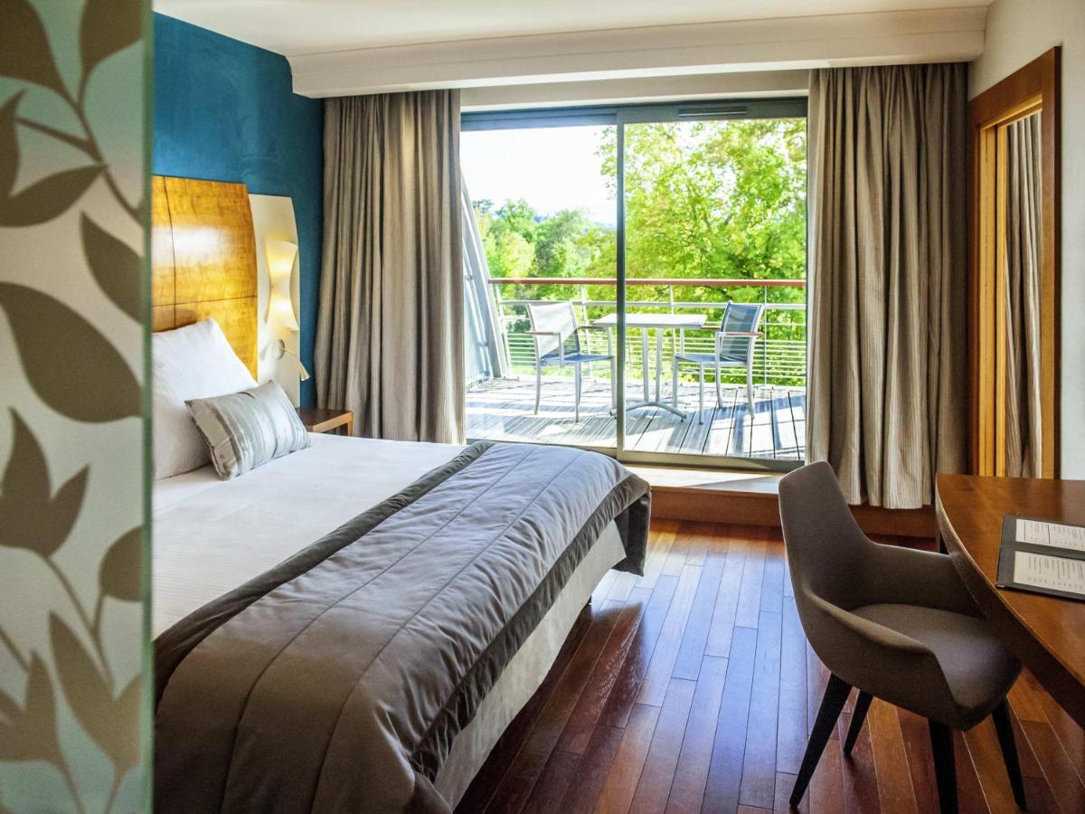 Un ou plusieurs lits dans un hébergement de l'établissement Parc Beaumont Hôtel & Spa Pau - MGallery Collection