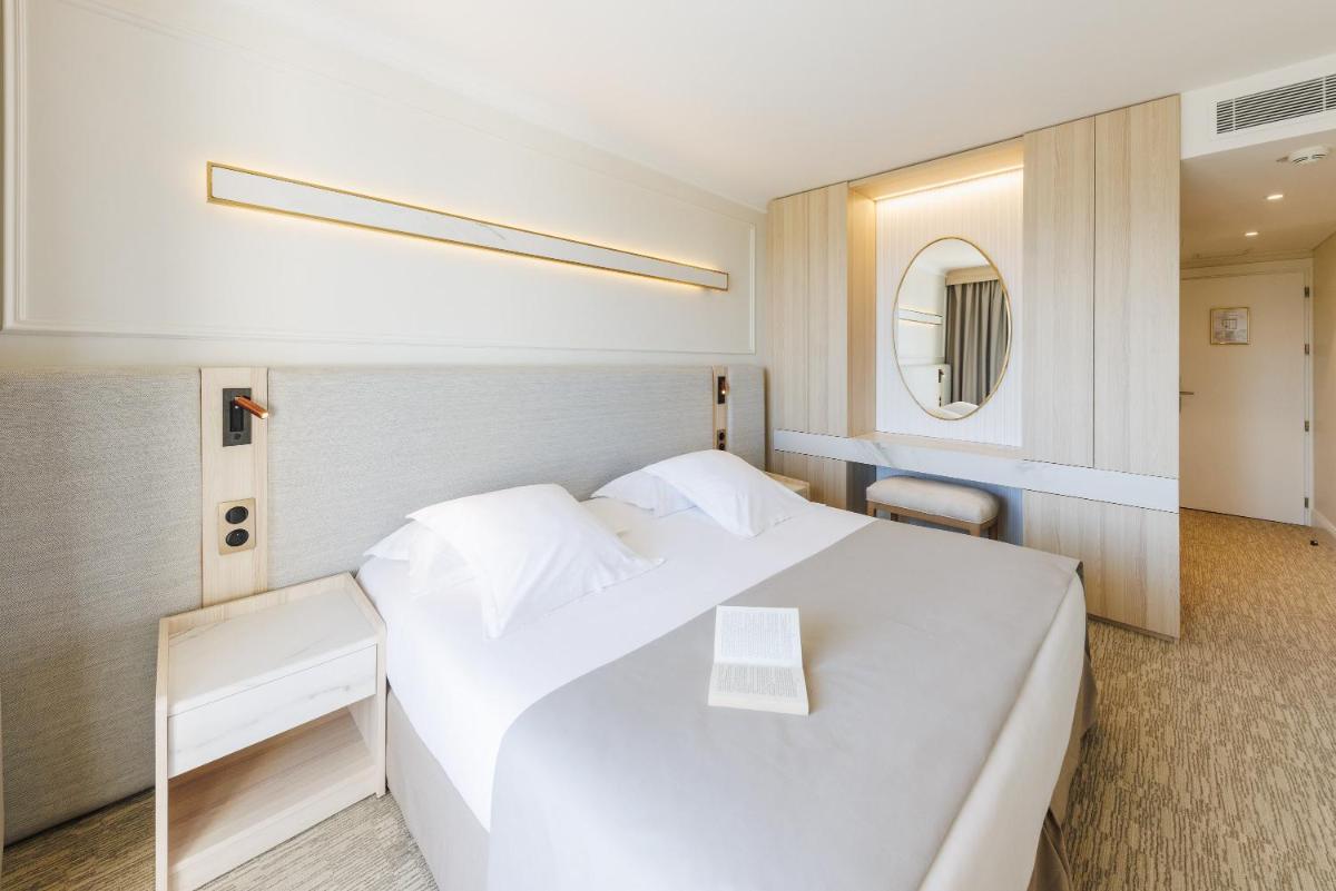 Un ou plusieurs lits dans un hébergement de l'établissement Hotel Corsica & Spa Serena