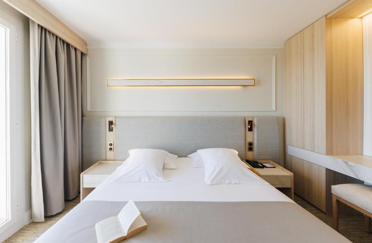 Un ou plusieurs lits dans un hébergement de l'établissement Hotel Corsica & Spa Serena