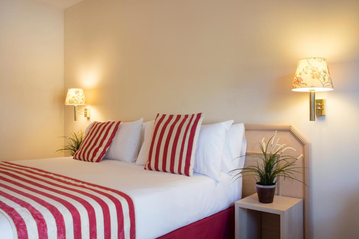 Cama o camas de una habitación en Luna Club Hotel Yoga & Spa 4Sup