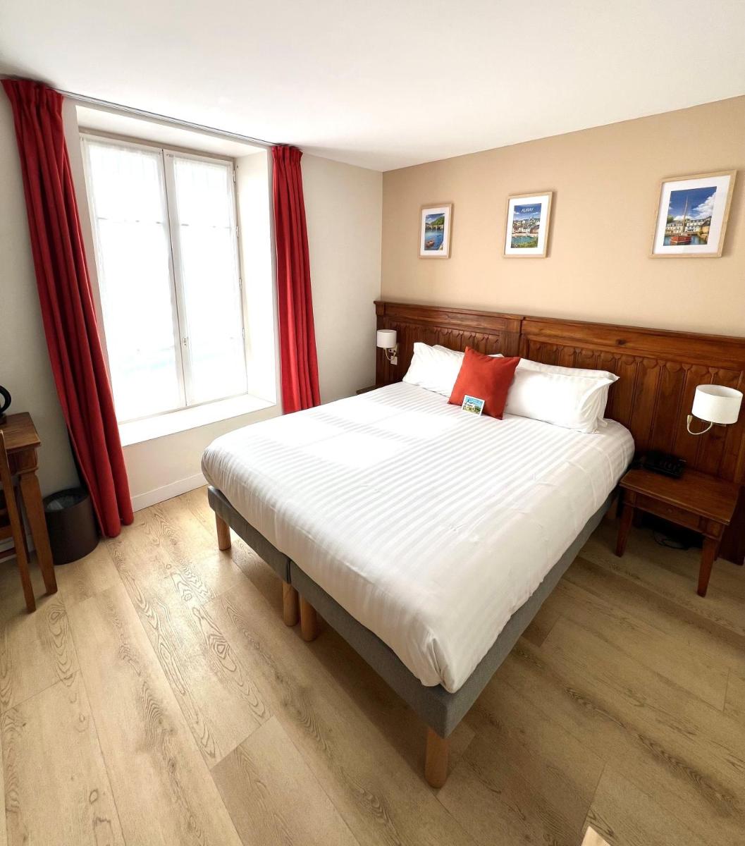 Un ou plusieurs lits dans un hébergement de l'établissement Hotel Restaurant Spa du Tumulus Carnac