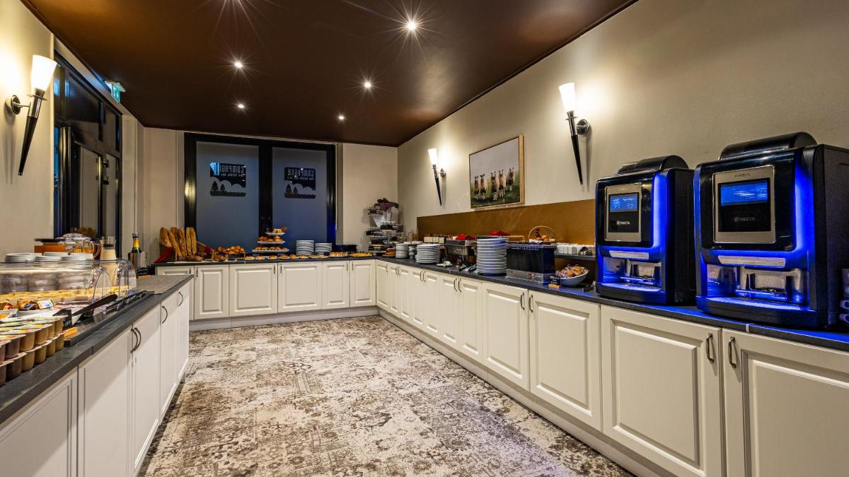 Cuisine ou kitchenette dans l'établissement Hôtel Beau Rivage