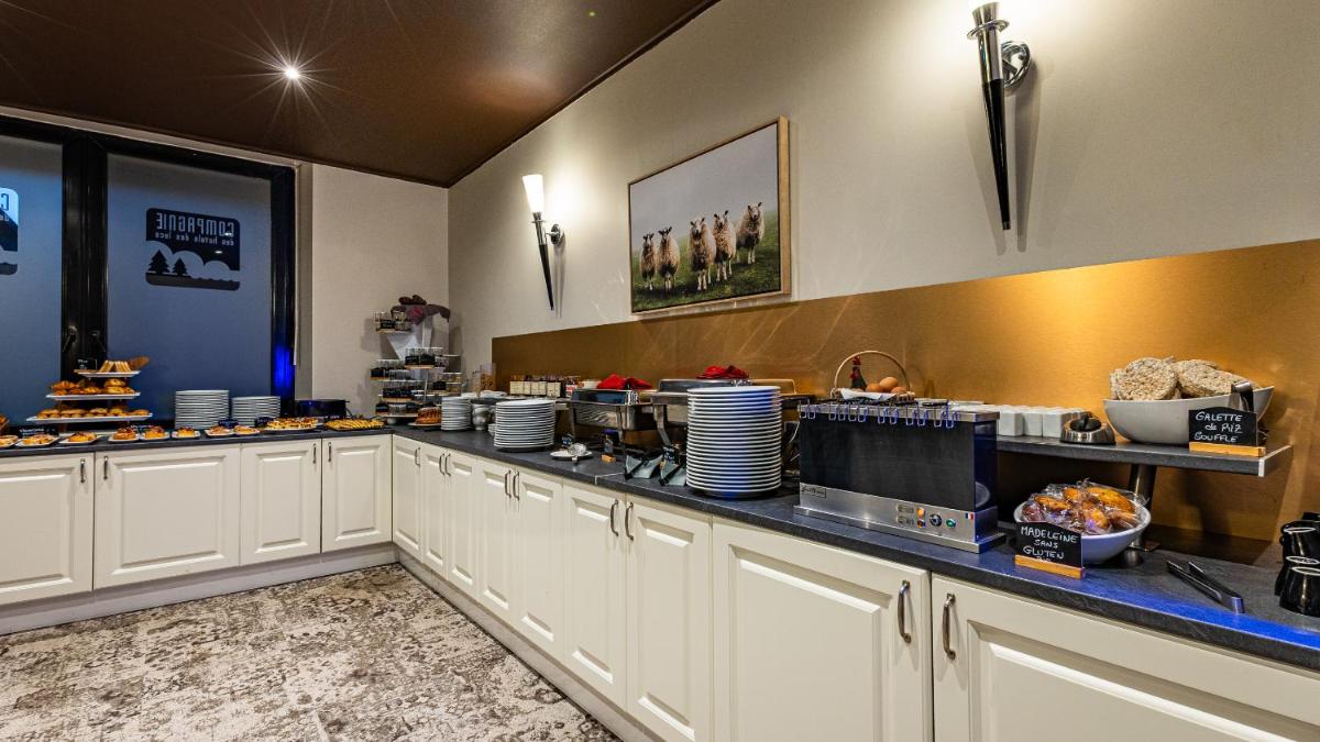 Cuisine ou kitchenette dans l'établissement Hôtel Beau Rivage