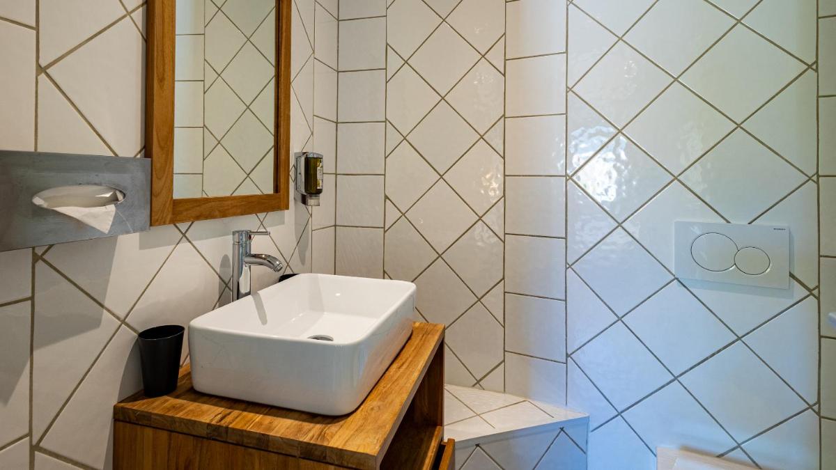 Salle de bains dans l'établissement Hôtel Beau Rivage