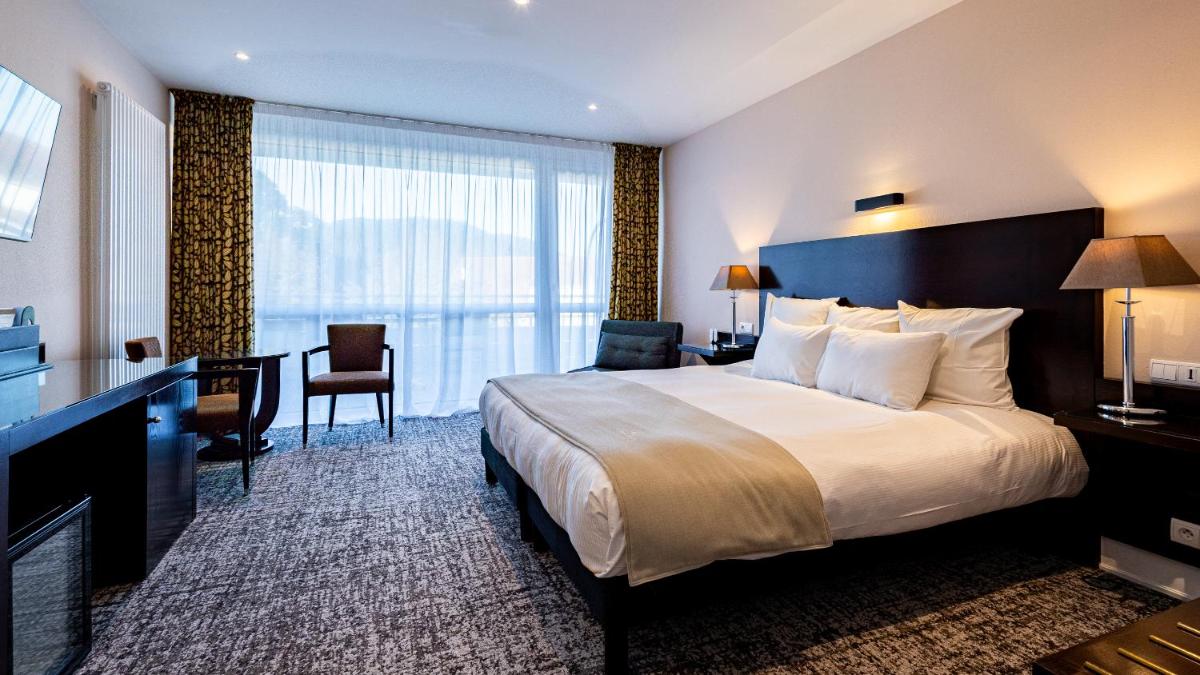 Un ou plusieurs lits dans un hébergement de l'établissement Hôtel Beau Rivage