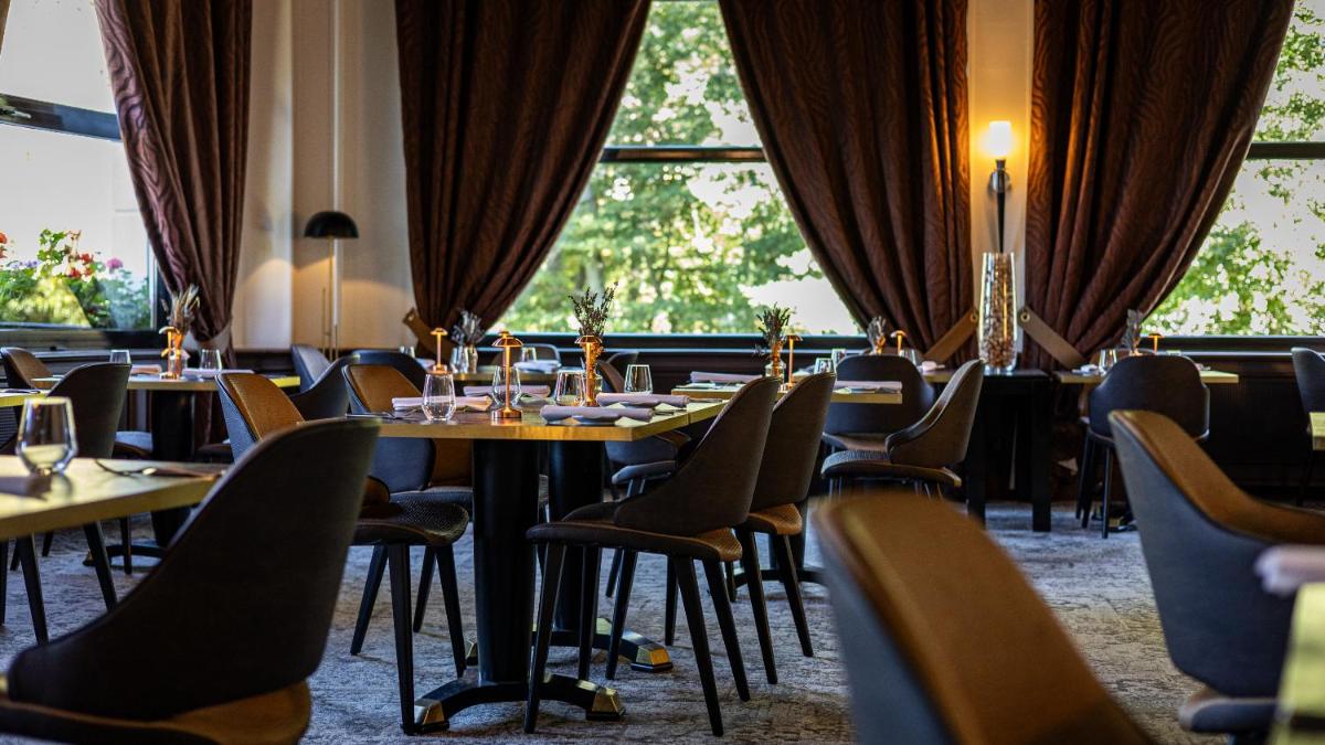Restaurant ou autre lieu de restauration dans l'établissement Hôtel Beau Rivage