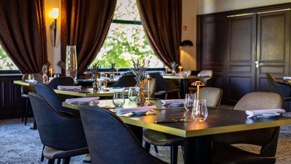 Coin salon dans l'établissement Hôtel Beau Rivage