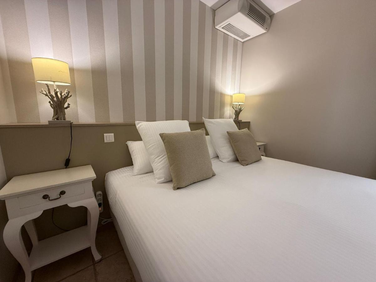 Un ou plusieurs lits dans un hébergement de l'établissement CÉRÈS - Boutique-Hôtel & Spa