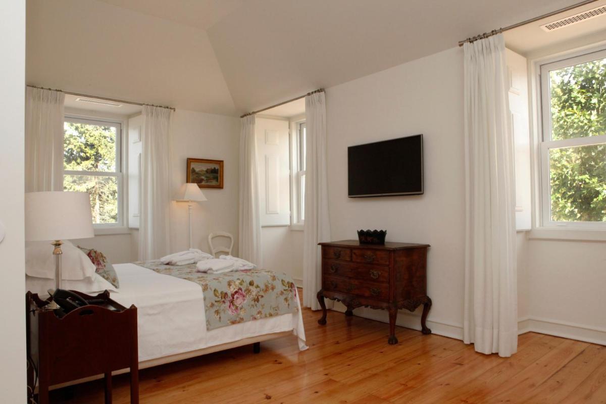 Uma cama ou camas num quarto em Hotel Casa Palmela - Small Luxury Hotels of The World, Hotel & Villas