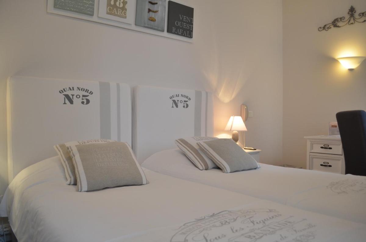 Un ou plusieurs lits dans un hébergement de l'établissement Grand Hôtel des Bains SPA