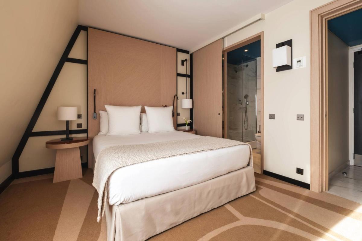 Un ou plusieurs lits dans un hébergement de l'établissement Hôtel Bel Ami