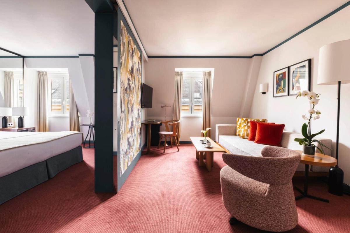 Un ou plusieurs lits dans un hébergement de l'établissement Hôtel Bel Ami