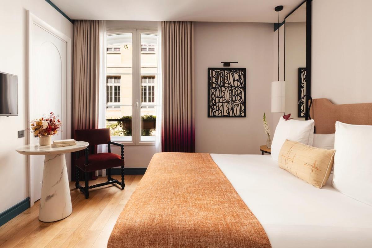 Un ou plusieurs lits dans un hébergement de l'établissement Hôtel Bel Ami