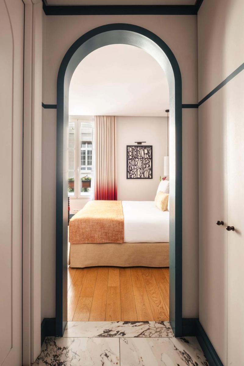 Un ou plusieurs lits dans un hébergement de l'établissement Hôtel Bel Ami
