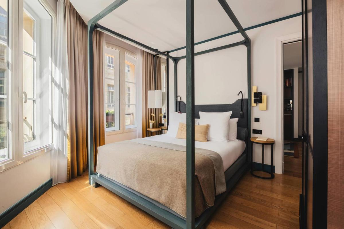 Un ou plusieurs lits dans un hébergement de l'établissement Hôtel Bel Ami