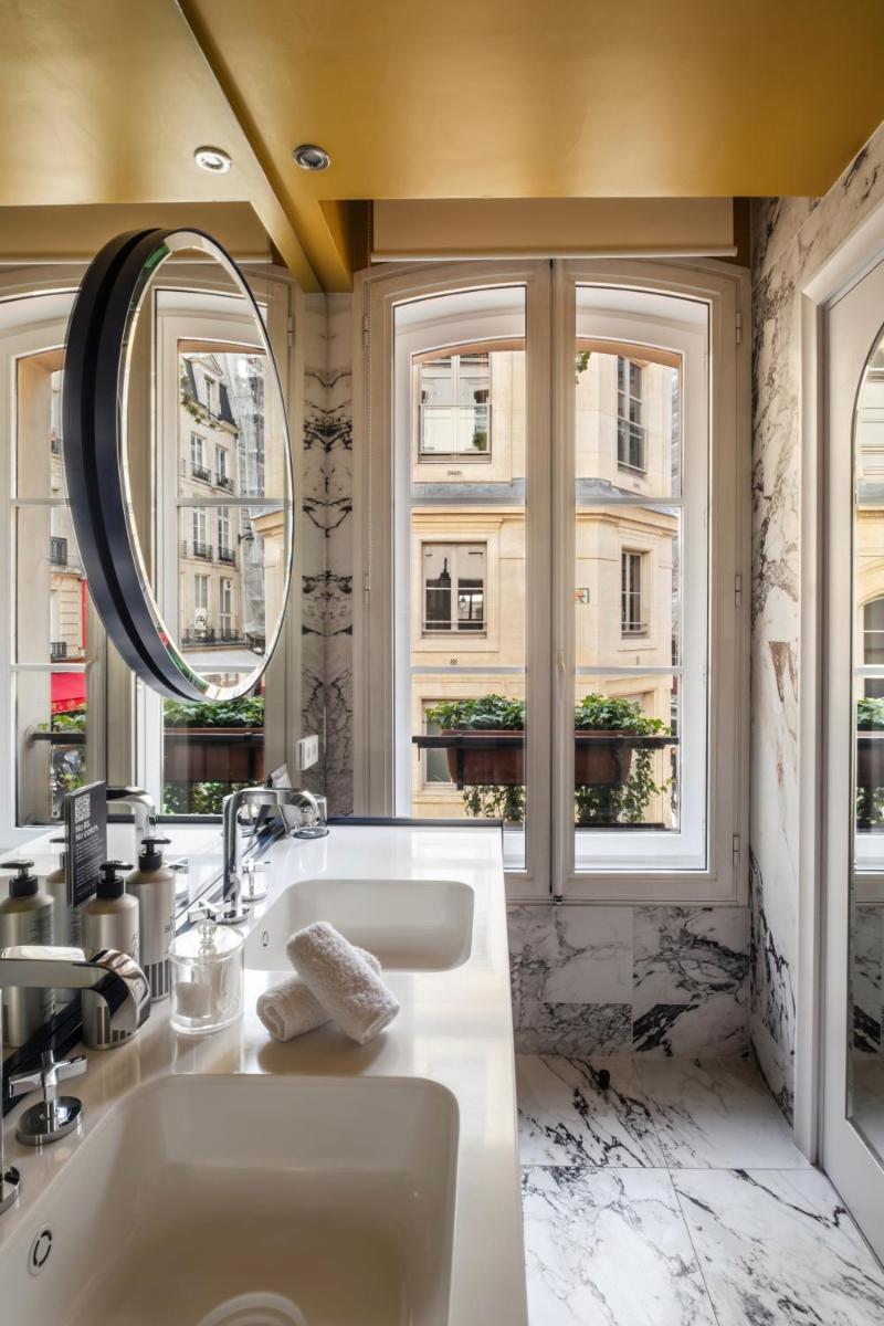 Un ou plusieurs lits dans un hébergement de l'établissement Hôtel Bel Ami