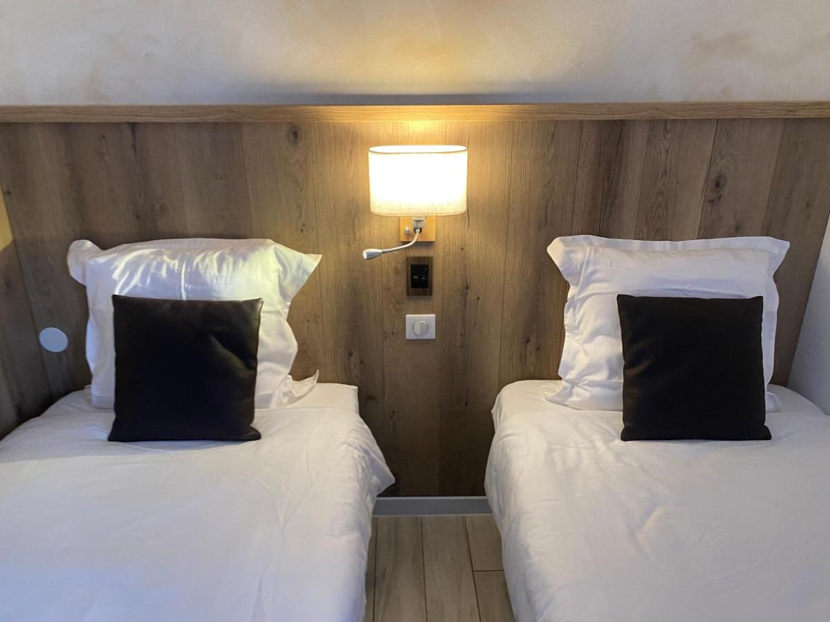 Un ou plusieurs lits dans un hébergement de l'établissement Le Moulin d'Oscar & Spa - Mulhouse Nord