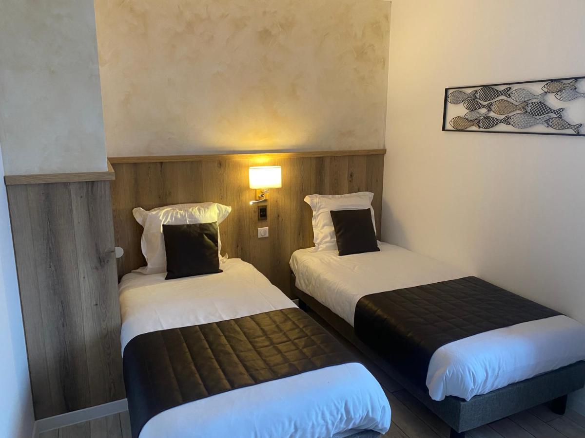 Un ou plusieurs lits dans un hébergement de l'établissement Le Moulin d'Oscar & Spa - Mulhouse Nord