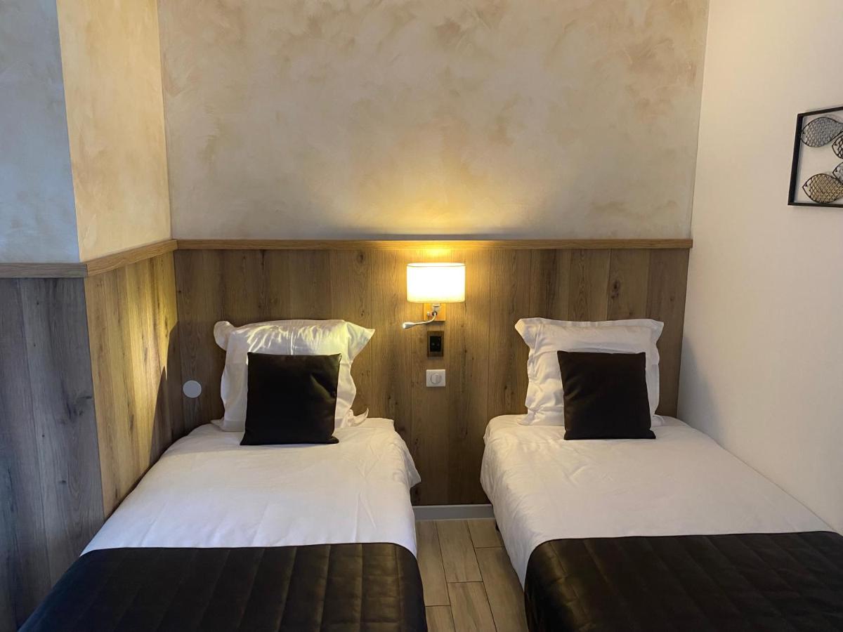 Un ou plusieurs lits dans un hébergement de l'établissement Le Moulin d'Oscar & Spa - Mulhouse Nord