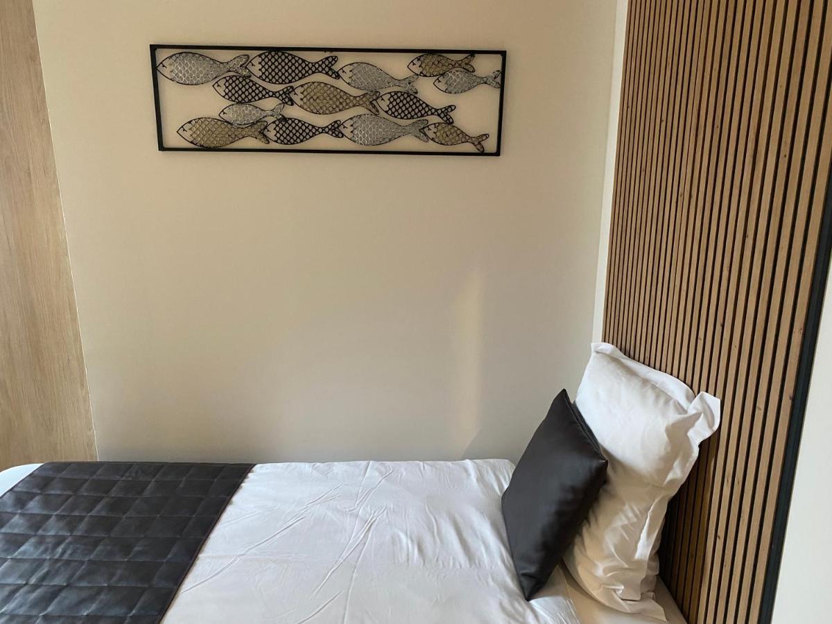 Un ou plusieurs lits dans un hébergement de l'établissement Le Moulin d'Oscar & Spa - Mulhouse Nord