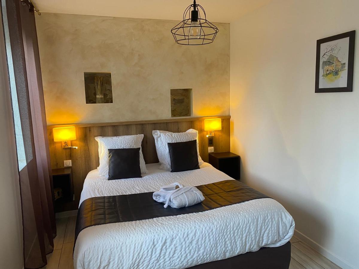 Un ou plusieurs lits dans un hébergement de l'établissement Le Moulin d'Oscar & Spa - Mulhouse Nord