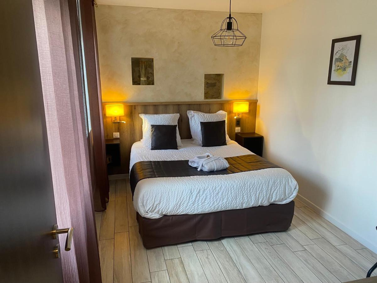 Un ou plusieurs lits dans un hébergement de l'établissement Le Moulin d'Oscar & Spa - Mulhouse Nord