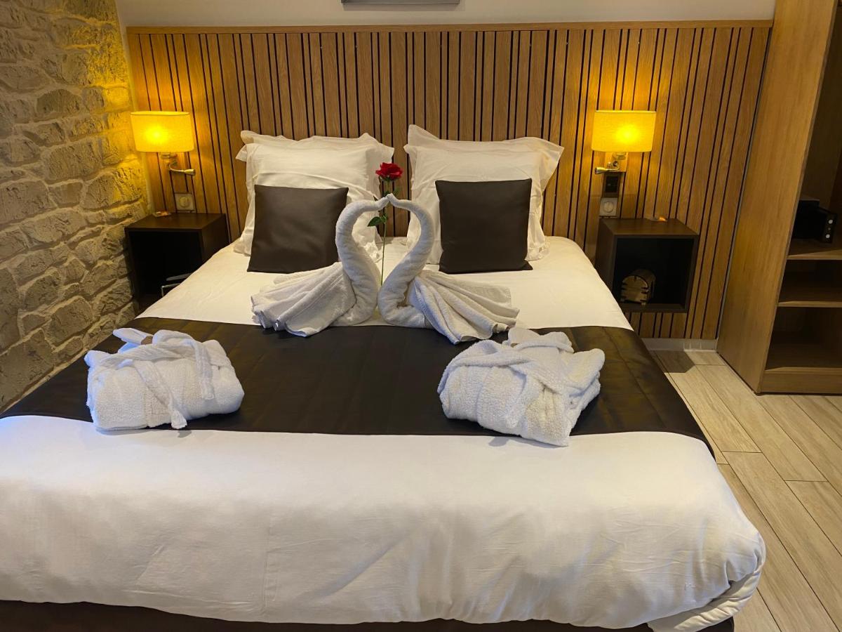 Un ou plusieurs lits dans un hébergement de l'établissement Le Moulin d'Oscar & Spa - Mulhouse Nord