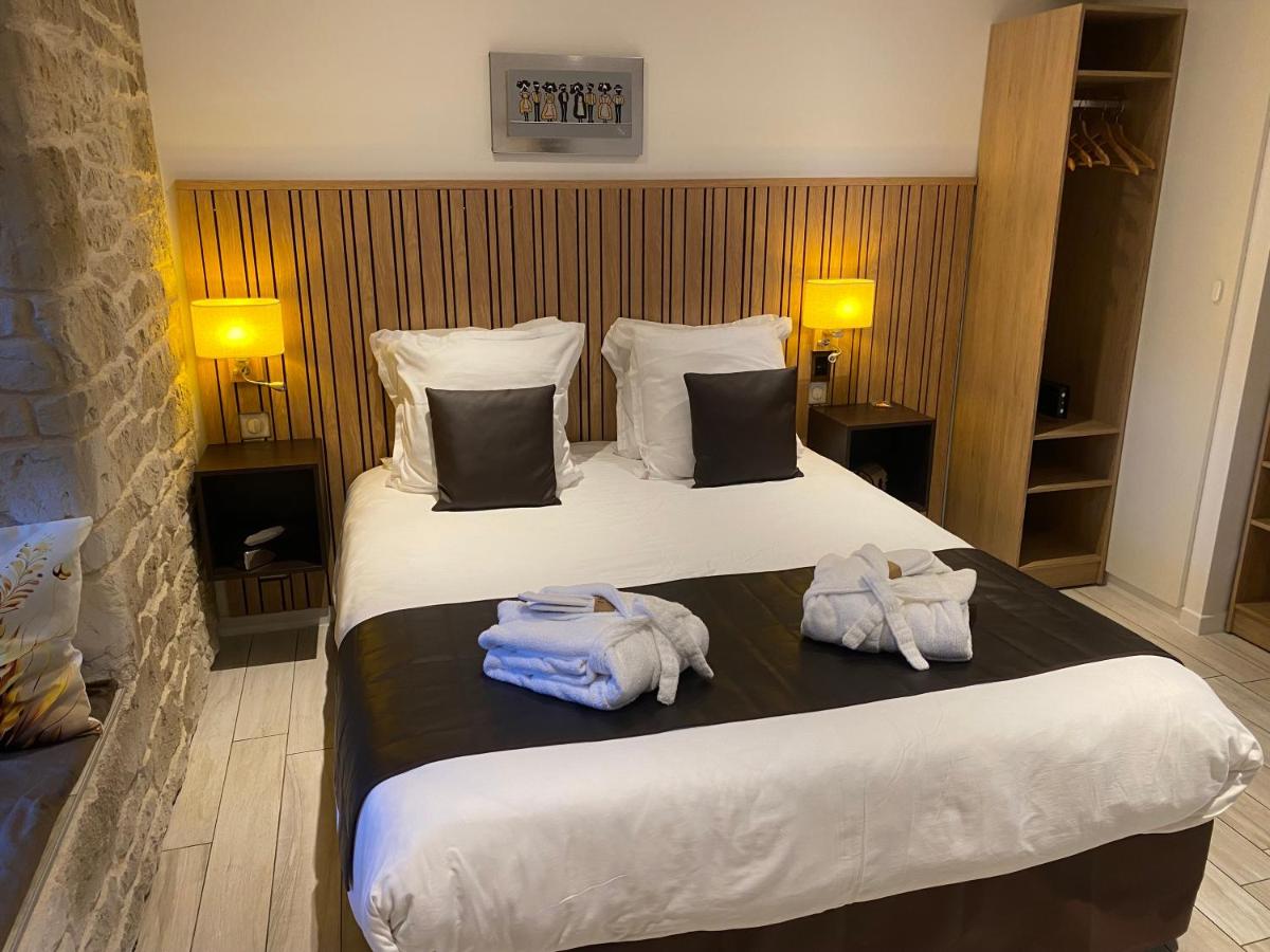 Un ou plusieurs lits dans un hébergement de l'établissement Le Moulin d'Oscar & Spa - Mulhouse Nord