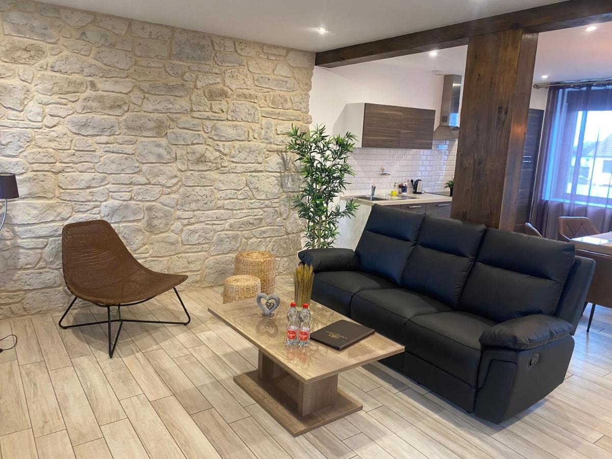 Coin salon dans l'établissement Le Moulin d'Oscar & Spa - Mulhouse Nord
