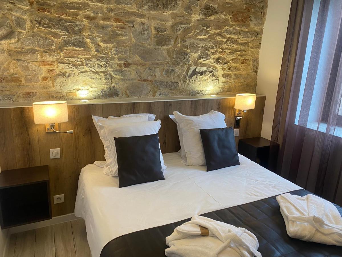 Un ou plusieurs lits dans un hébergement de l'établissement Le Moulin d'Oscar & Spa - Mulhouse Nord