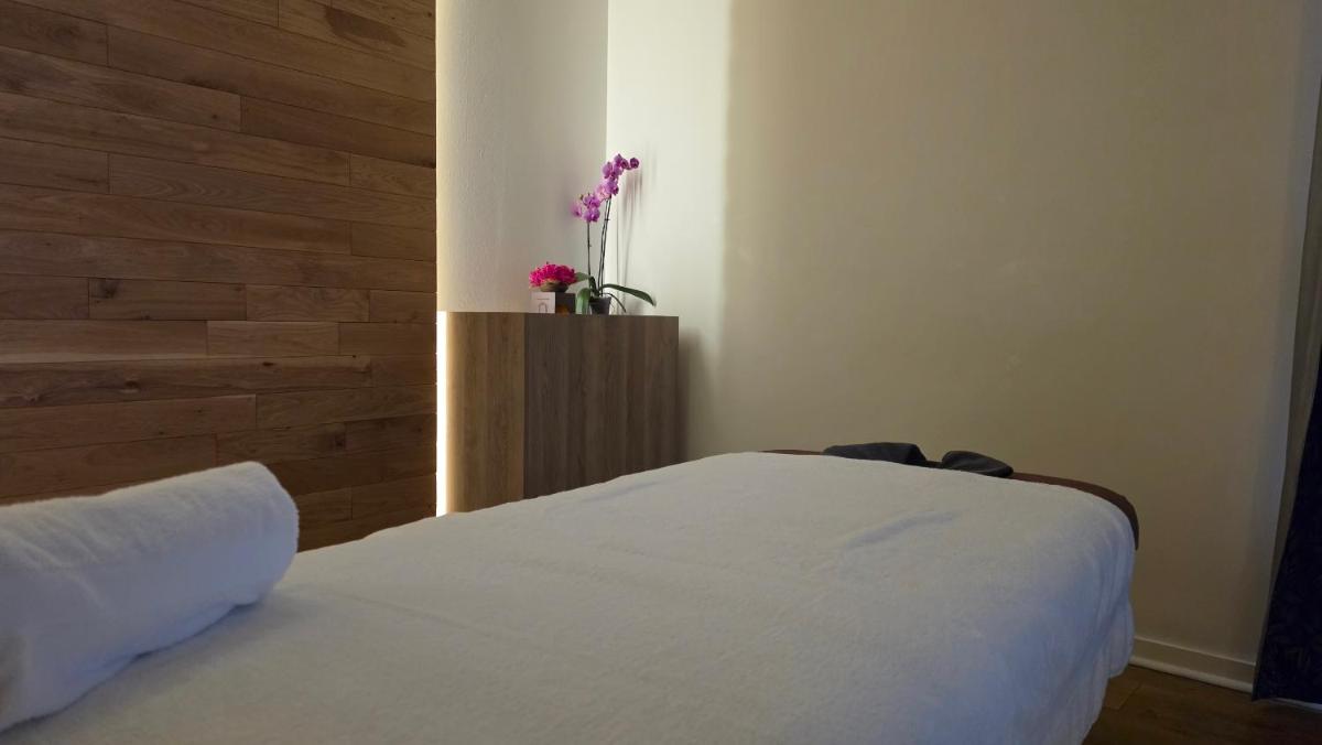 Un ou plusieurs lits dans un hébergement de l'établissement Mercure Saint Nectaire - Spa & Bien-Être