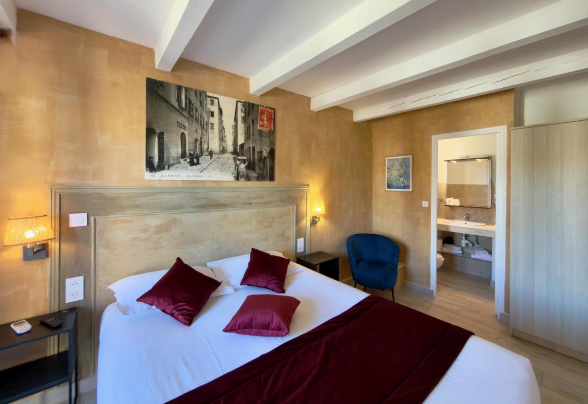 Un ou plusieurs lits dans un hébergement de l'établissement Hôtel Casa Rossa & Spa