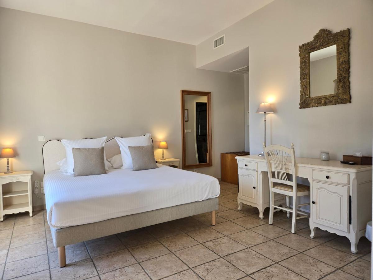 Un ou plusieurs lits dans un hébergement de l'établissement CÉRÈS - Boutique-Hôtel & Spa