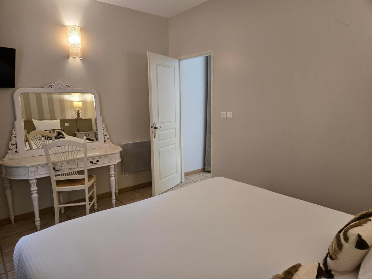 Un ou plusieurs lits dans un hébergement de l'établissement CÉRÈS - Boutique-Hôtel & Spa