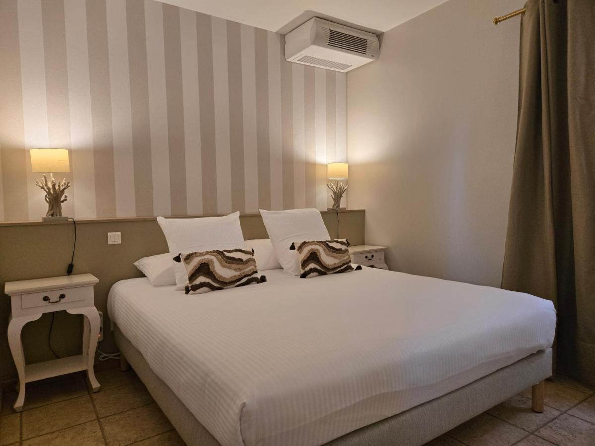 Un ou plusieurs lits dans un hébergement de l'établissement CÉRÈS - Boutique-Hôtel & Spa
