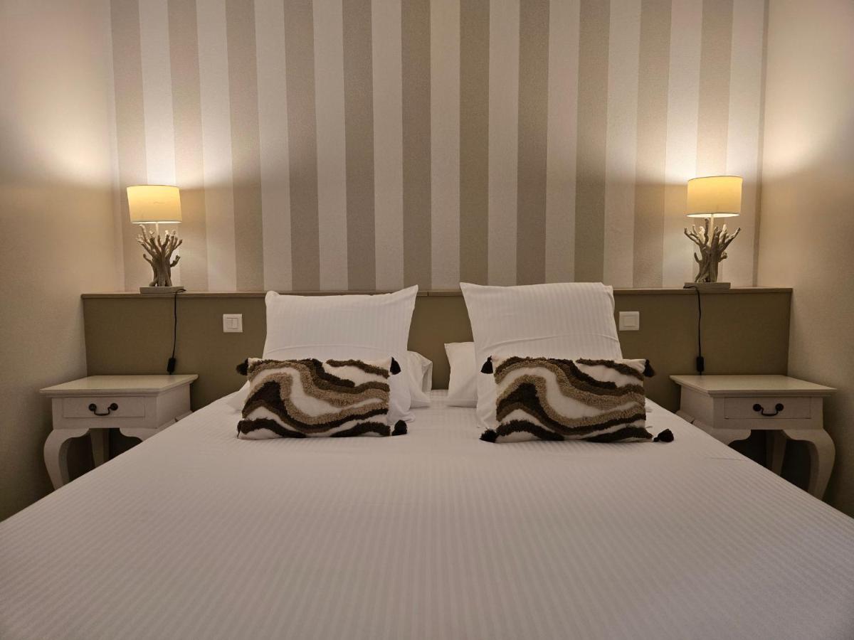 Un ou plusieurs lits dans un hébergement de l'établissement CÉRÈS - Boutique-Hôtel & Spa