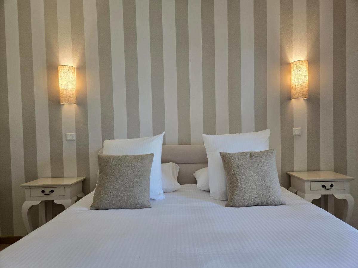 Un ou plusieurs lits dans un hébergement de l'établissement CÉRÈS - Boutique-Hôtel & Spa