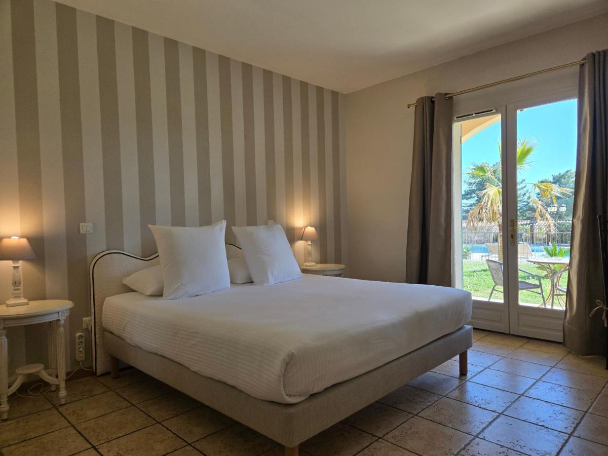 Un ou plusieurs lits dans un hébergement de l'établissement CÉRÈS - Boutique-Hôtel & Spa
