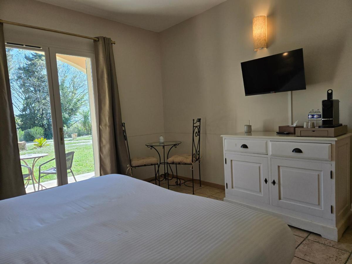 Un ou plusieurs lits dans un hébergement de l'établissement CÉRÈS - Boutique-Hôtel & Spa
