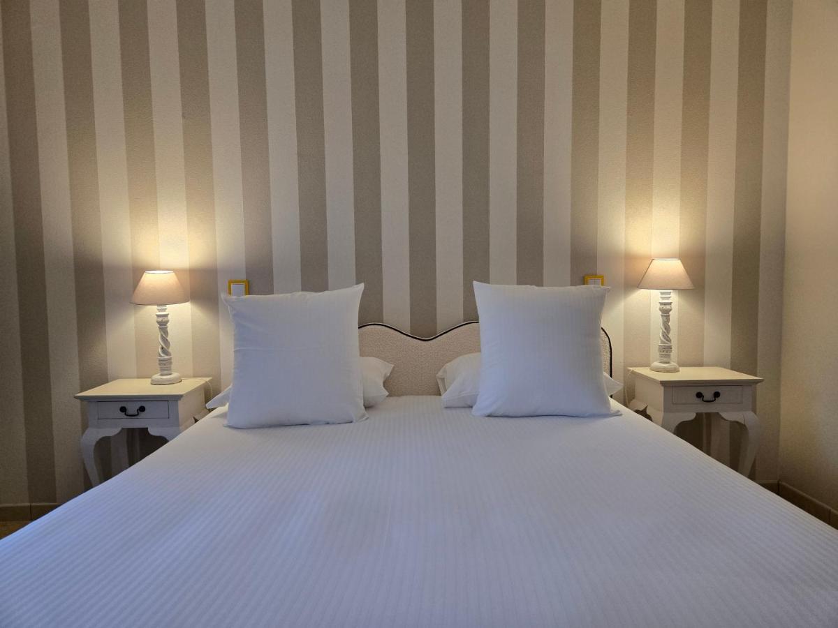 Un ou plusieurs lits dans un hébergement de l'établissement CÉRÈS - Boutique-Hôtel & Spa