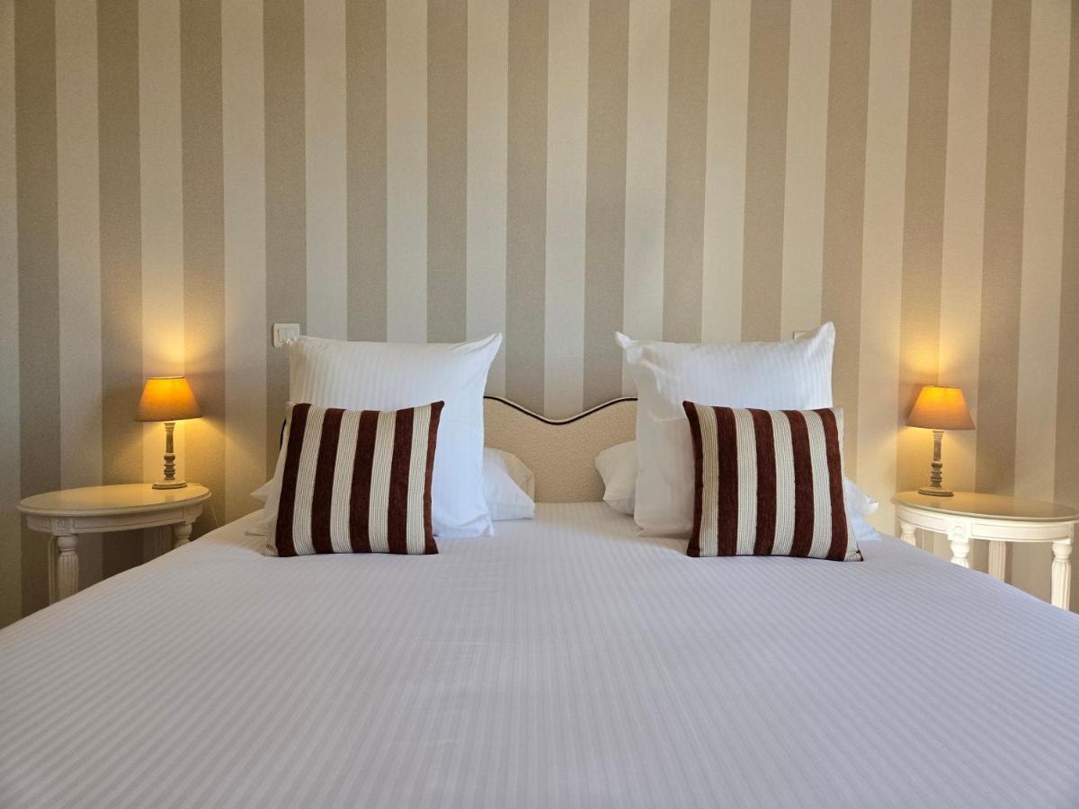 Un ou plusieurs lits dans un hébergement de l'établissement CÉRÈS - Boutique-Hôtel & Spa