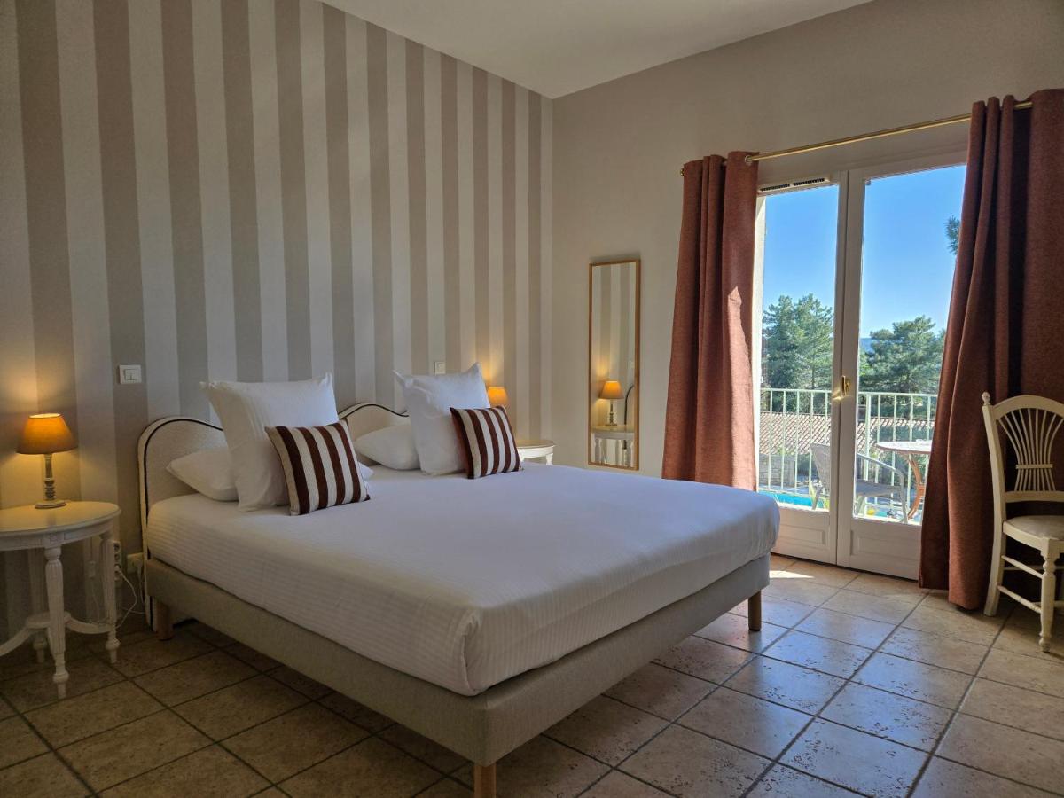 Un ou plusieurs lits dans un hébergement de l'établissement CÉRÈS - Boutique-Hôtel & Spa