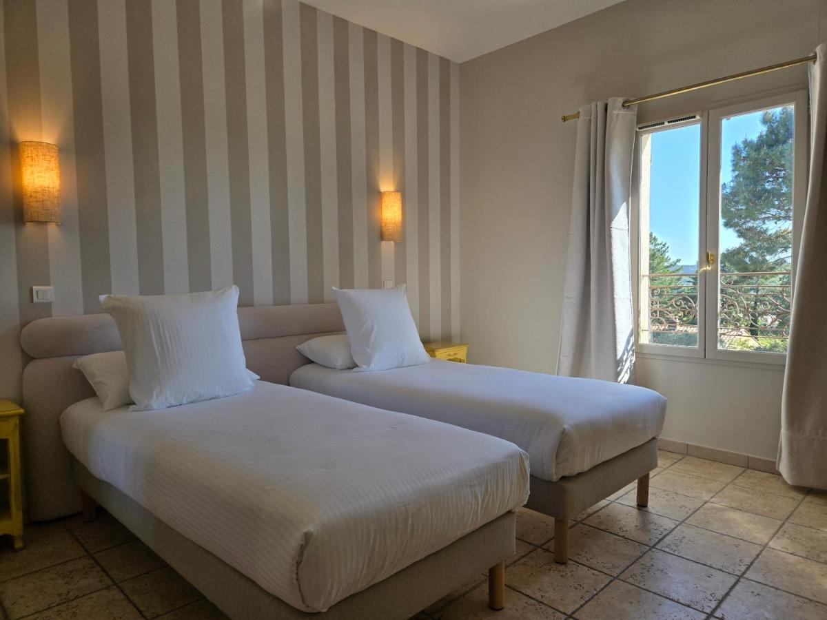 Un ou plusieurs lits dans un hébergement de l'établissement CÉRÈS - Boutique-Hôtel & Spa