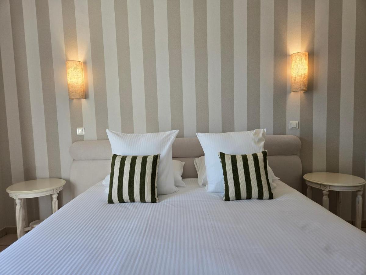 Un ou plusieurs lits dans un hébergement de l'établissement CÉRÈS - Boutique-Hôtel & Spa