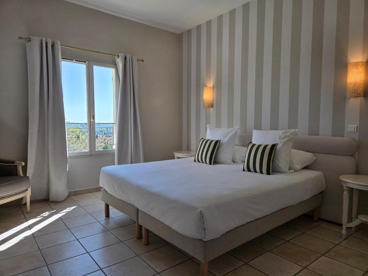 Un ou plusieurs lits dans un hébergement de l'établissement CÉRÈS - Boutique-Hôtel & Spa