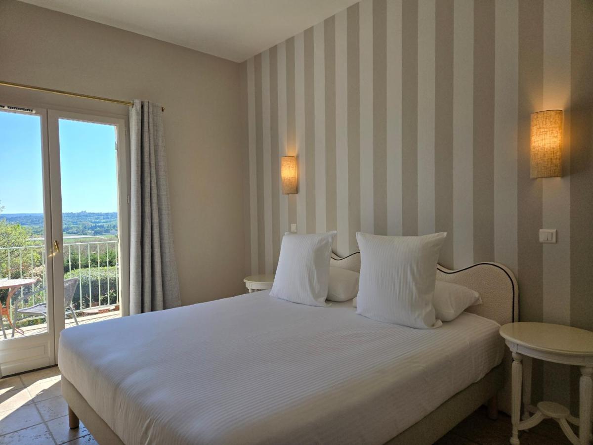 Un ou plusieurs lits dans un hébergement de l'établissement CÉRÈS - Boutique-Hôtel & Spa