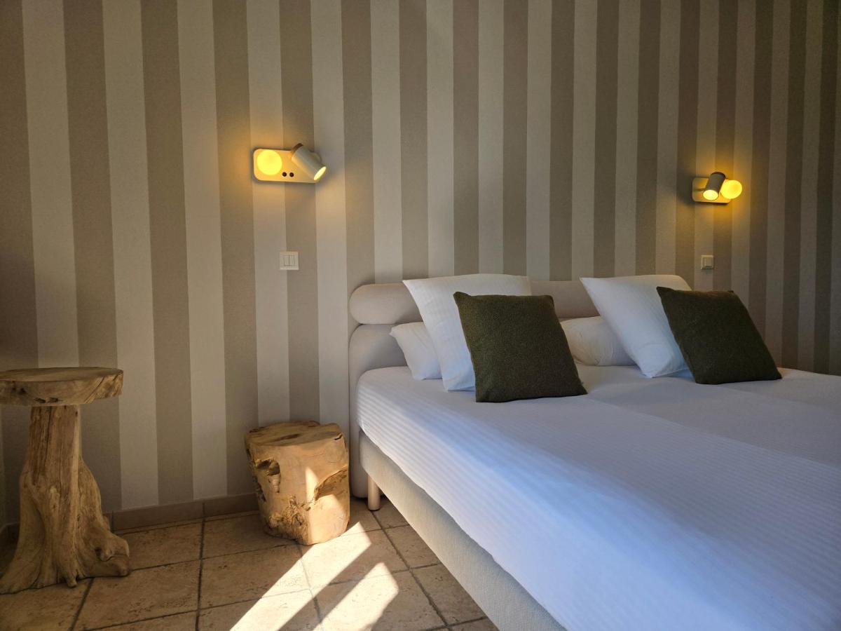 Un ou plusieurs lits dans un hébergement de l'établissement CÉRÈS - Boutique-Hôtel & Spa