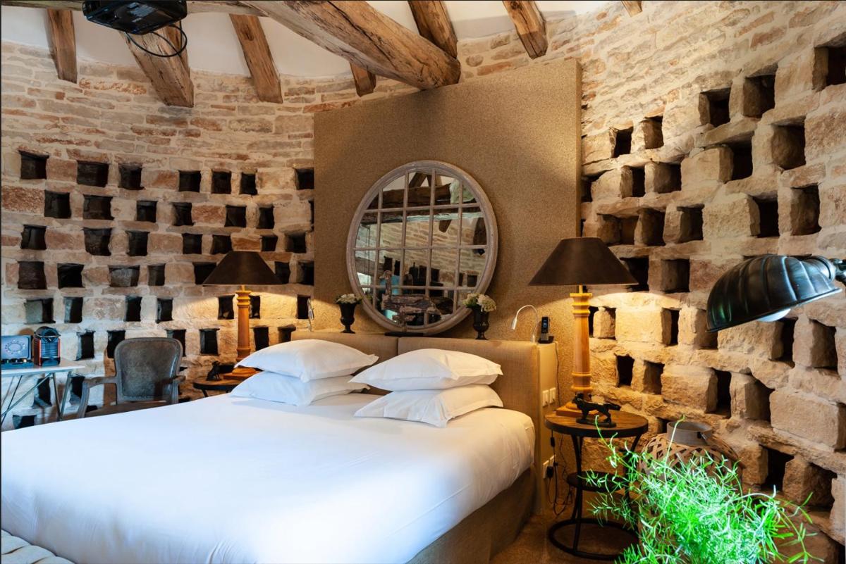 Un ou plusieurs lits dans un hébergement de l'établissement Château de Courban and Spa Nuxe