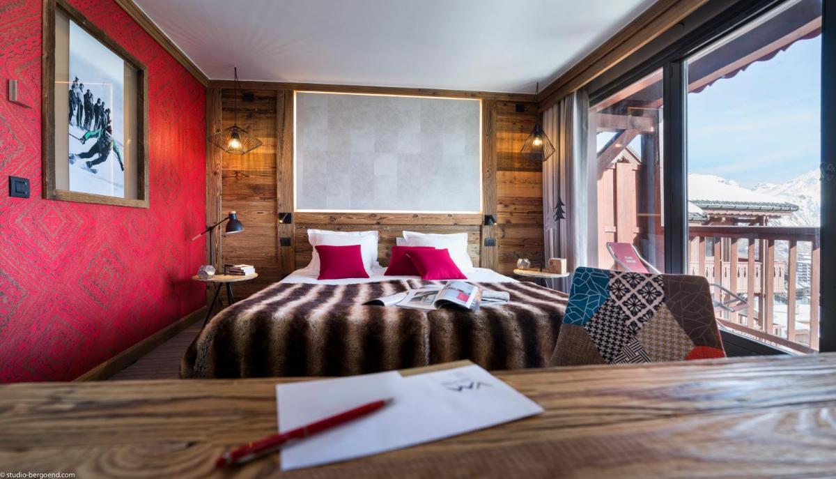 Un ou plusieurs lits dans un hébergement de l'établissement Hôtel Village Montana by Les Etincelles